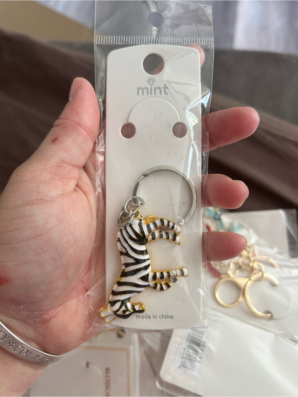 4/$50 Mint Zebra Enamel Keychain - White, Black & Gold